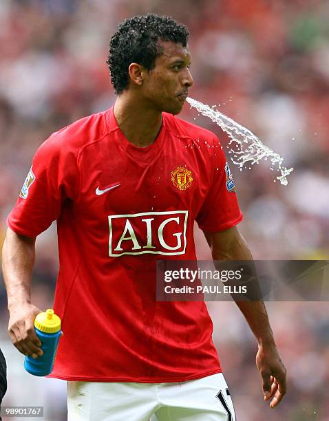 Manchester United's Portugese midfielder Nani reacts after being sent off for violent conduct on West Ham United's Australian defender Lucas Neill...