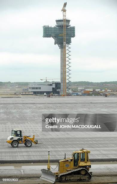 View of the control tower through a window in the main terminal of the Berlin-Brandenburg International airport during a traditional "topping off"...
