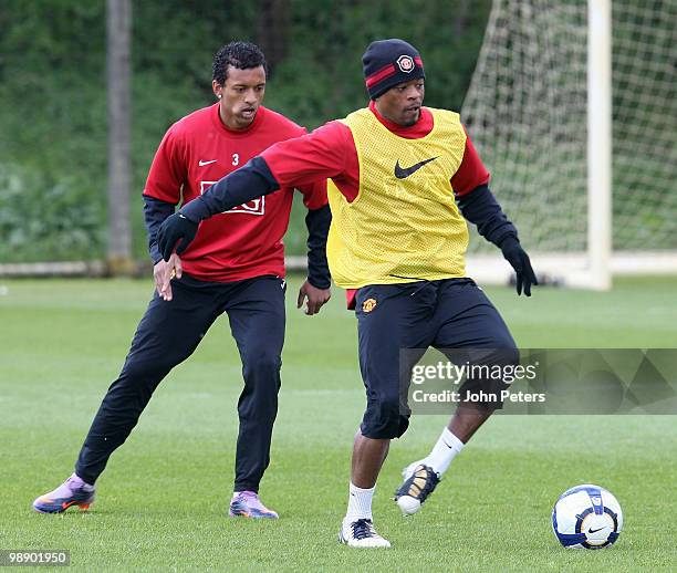 Nani and Patrice Evra of Manchester United in action during a First Team Training Session at Carrington Training Ground on May 7 2010 in Manchester,...