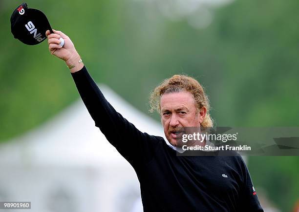 Miguel Angel Jimenez of Spain waves his cap on the nineth hole during the second round of the BMW Italian Open at Royal Park I Roveri on May 7, 2010...