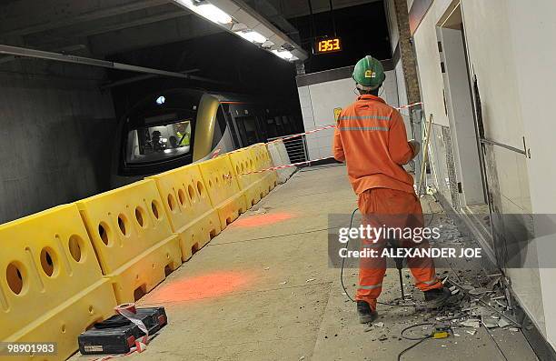 Employees work at Sandton station built for the Gautrain, South Africa's first high-speed train, in Johannesburg on May 6, 2010. The line will open...
