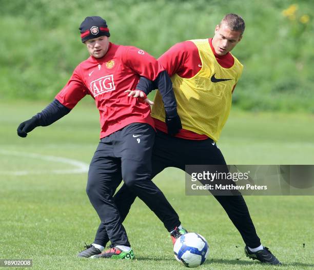 Wayne Rooney and Nemanja Vidic of Manchester United in action during a First Team Training Session at Carrington Training Ground on May 7 2010, in...