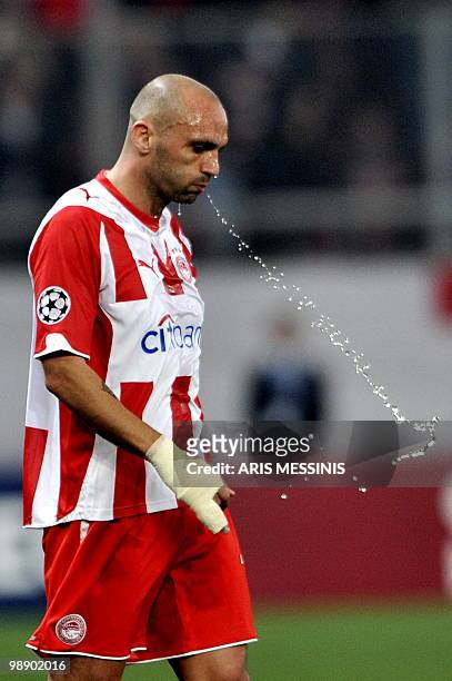 Olympiacos' Raul Bravo spits water during a round of 16, UEFA Champions League football game against Bordeaux at the Karaiskaki stadium in Athens on...