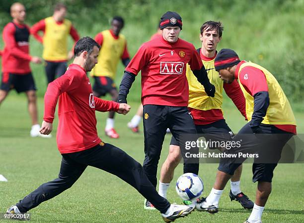 Wayne Rooney and Gary Neville of Manchester United in action during a First Team Training Session at Carrington Training Ground on May 7 2010, in...