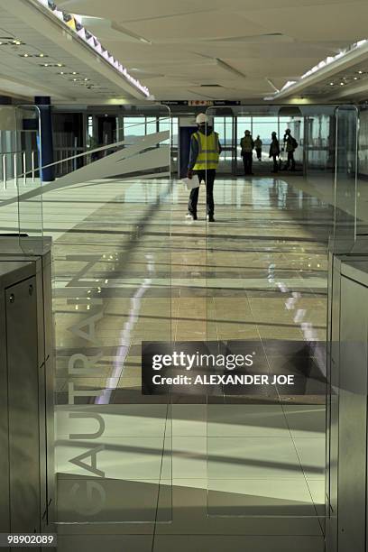 Employees work at the OR Tambo International Airport station built for the Gautrain, South Africa's first high-speed train, in Johannesburg on May 6,...
