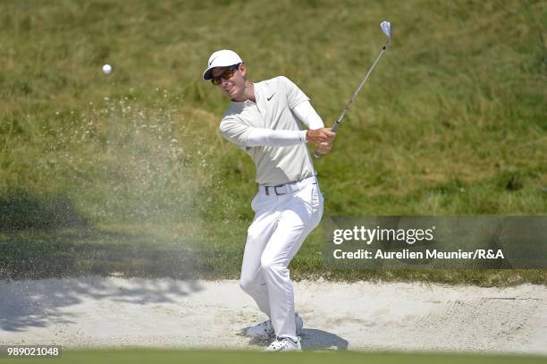 Dylan Frittelli of South Africa swings out of a bunker during The Open Qualifying Series part of the HNA Open de France at Le Golf National on July...