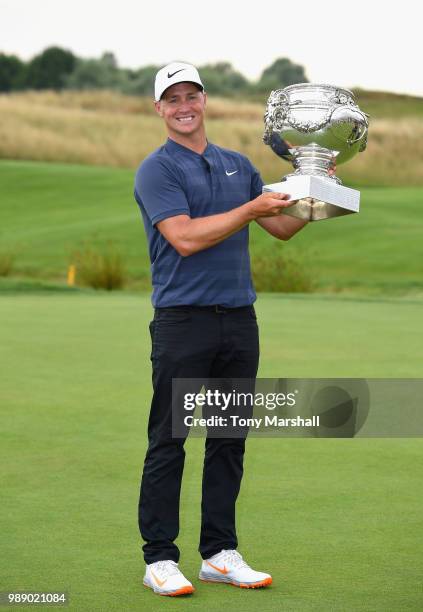 Alex Noren of Sweden poses with the trophy after winning the 2018 HNA Open de France during final round of the HNA Open de France at Le Golf National...