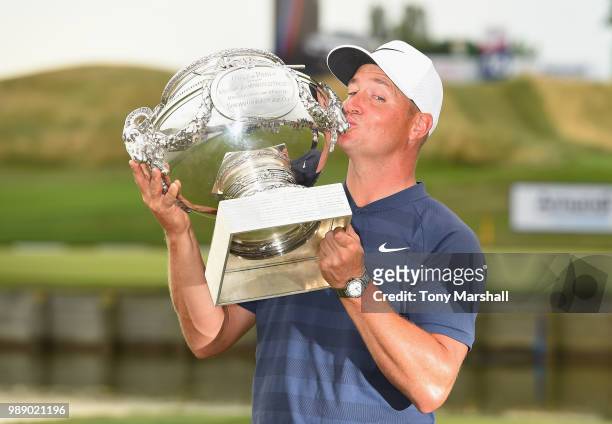 Alex Noren of Sweden poses with the trophy after winning the 2018 HNA Open de France during final round of the HNA Open de France at Le Golf National...