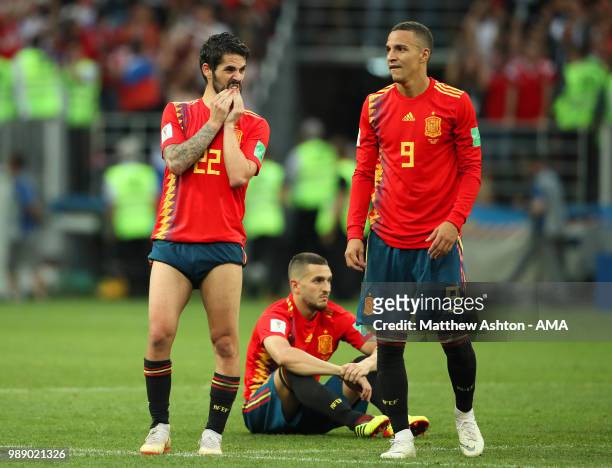 Isco of Spain and Rodrigo of Spain look dejected after their team were eliminated during a penalty shootout during the 2018 FIFA World Cup Russia...