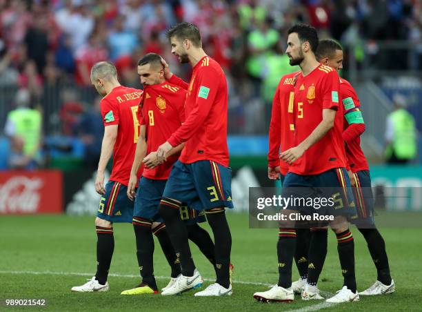 Gerard Pique consoles team mate Koke of Spain following him missing his team's third penalty in the penalty shoot out during the 2018 FIFA World Cup...