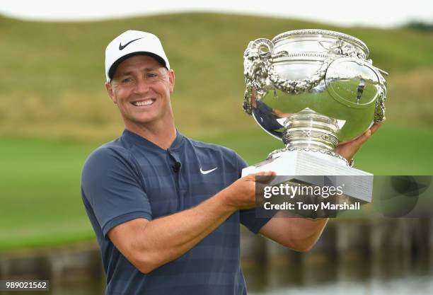 Alex Noren of Sweden poses with the trophy after winning the 2018 HNA Open de France during final round of the HNA Open de France at Le Golf National...