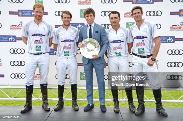 Eddie Redmayne poses with Prince Harry, Duke of Sussex, Charlie Hanbury, Ollie Cudmore and Malcolm Borwick at the Audi Polo Challenge at Coworth Park...