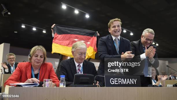 Germanys ambassador to the United Nations Educational, Scientific, and Cultural Organisation , Stefan Krawielicki, is seen celebrating with the...