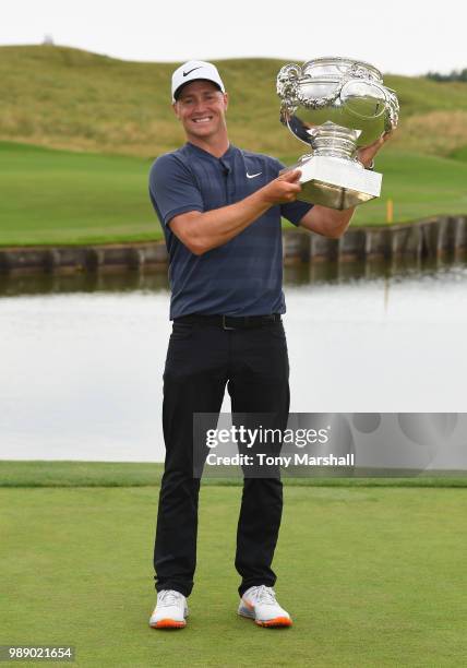 Alex Noren of Sweden poses with the trophy after winning the 2018 HNA Open de France during final round of the HNA Open de France at Le Golf National...