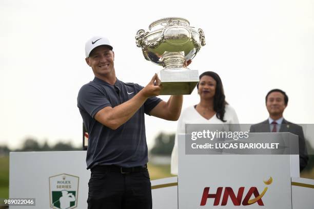 Swedish golfer Alex Noren holds the trophy after winning the HNA Open de France, as part of the European Tour 2018, at the Saint-Quentin-en-Yvelines...