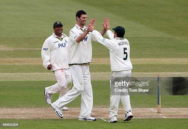 Charlie Shreck of Nottinghamshire celebrates taking the wicket of Rangana Herath of Hampshire during the LV County Championship match between...