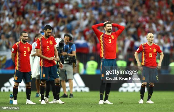 Spain players look dejected following team mate Koke missing his team's third penalty during the penalty shoot out during the 2018 FIFA World Cup...