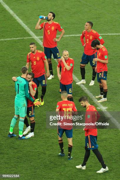 Detected Spain console one another after they are knocked out of the tournament on penalties during the 2018 FIFA World Cup Russia Round of 16 match...