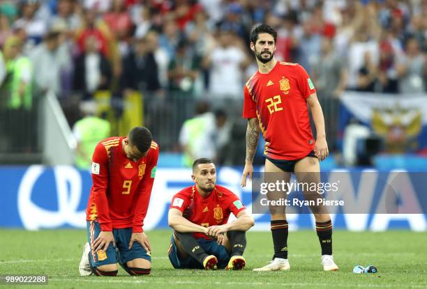 Spain players look dejected during the penalty shoot out during the 2018 FIFA World Cup Russia Round of 16 match between Spain and Russia at Luzhniki...