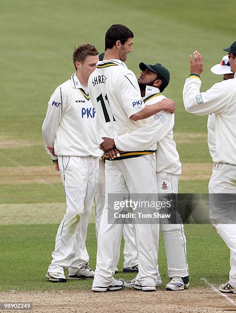 Charlie Shreck of Nottinghamshire celebrates with a hug from Bilal Shafayet of Nottinghamshire after taking the wicket of Kabir Ali of Hampshire...