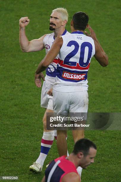 Jason Akermanis of the Bulldogs gestures after kicking a goal during the round seven AFL match between the Melbourne Demons and the Western Bulldogs...