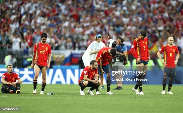 Spain players look dejected during the 2018 FIFA World Cup Russia Round of 16 match between Spain and Russia at Luzhniki Stadium on July 1, 2018 in...