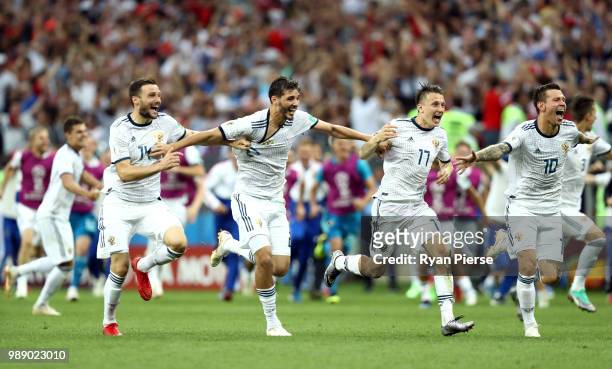 Russia players celebrate following their sides victory in a penalty shoot out during the 2018 FIFA World Cup Russia Round of 16 match between Spain...