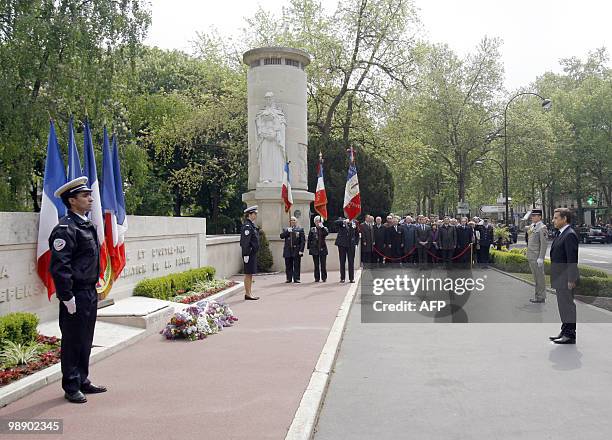 French President Nicolas Sarkozy pays his respect to French police officers killed in service, during a ceremony held in Neuilly, West of Paris,...