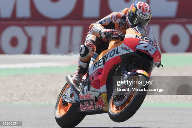 Dani Pedrosa of Spain and Repsol Honda Team lifts the front wheel during the MotoGp race during the MotoGP Netherlands - Race on July 1, 2018 in...