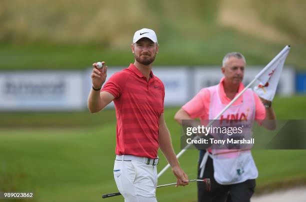 Chris Wood of England celebrates after finishing on the 18th green during final round of the HNA Open de France at Le Golf National on July 1, 2018...