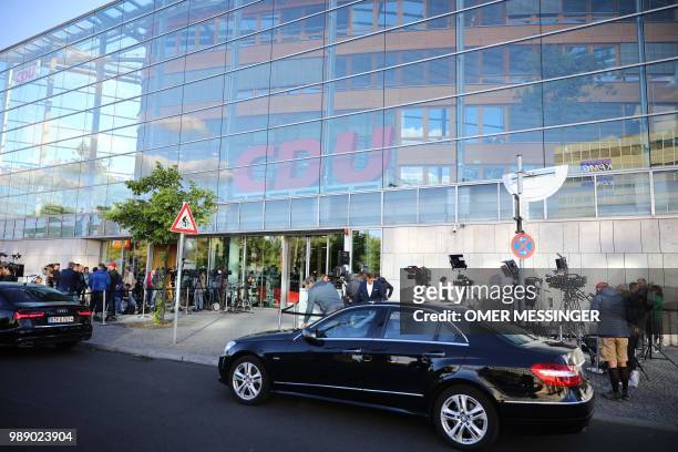 Jourbalists wait in front of the headquarters of the Christian Democratic Union during a party leadership meeting at the CDU headquarters in Berlin,...