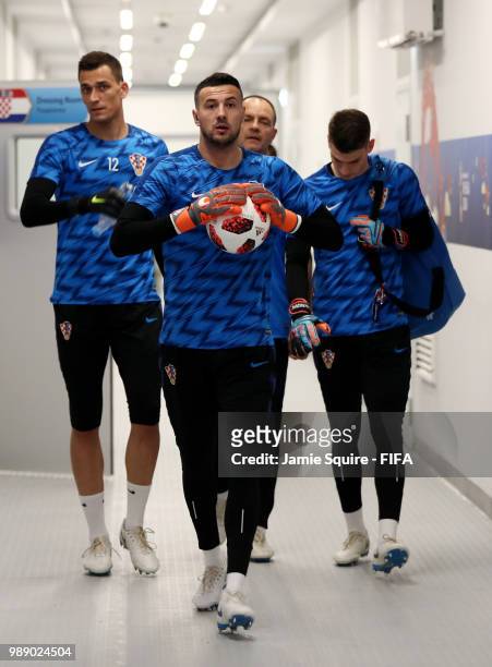 Lovre Kalinic, Danijel Subasic and Lovre Kalinic of Croatia walsk in the tunnel prior to the 2018 FIFA World Cup Russia Round of 16 match between...