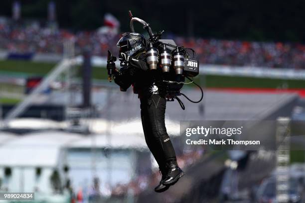 An entertainer with a jetpack performs before the Formula One Grand Prix of Austria at Red Bull Ring on July 1, 2018 in Spielberg, Austria.