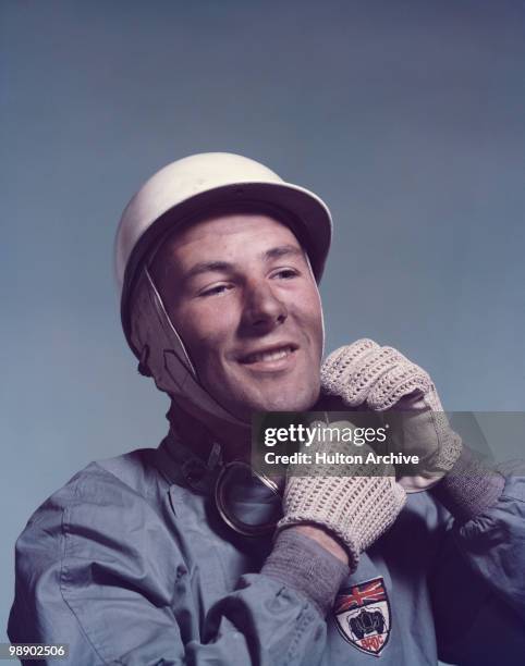 British racing driver Stirling Moss, circa 1955. He is wearing the badge of the British Racing Drivers' Club.