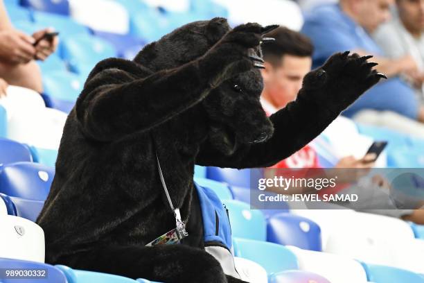 Fan dressed in a bear suit gestures before the Russia 2018 World Cup round of 16 football match between Croatia and Denmark at the Nizhny Novgorod...