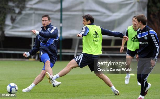 Frank Lampard and Juliano Belletti of Chelsea in action during a training session at the Cobham Training Ground on May 7, 2010 in Cobham, England.
