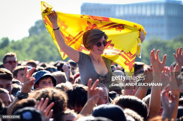 Music fans gesture during on day three of the 2018 TRNSMT festival at Glasgow Green, Glasgow on July 1, 2018.