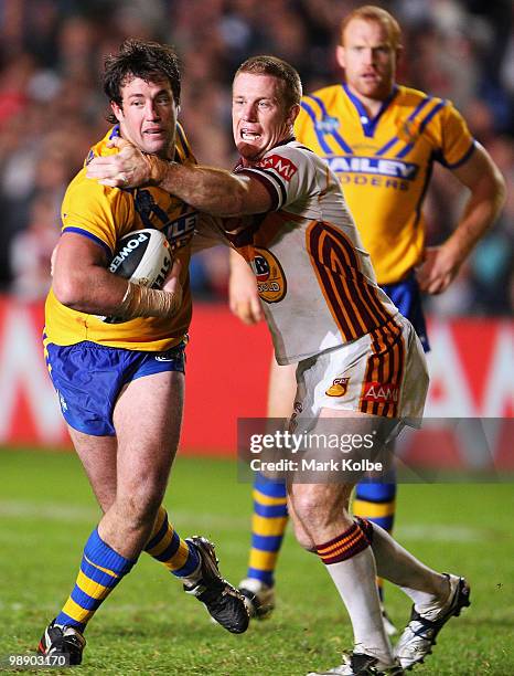 Trent Waterhouse of City tries to fend away Ben Creagh of Country during the ARL Origin match between Country and City at Regional Sports Stadium on...