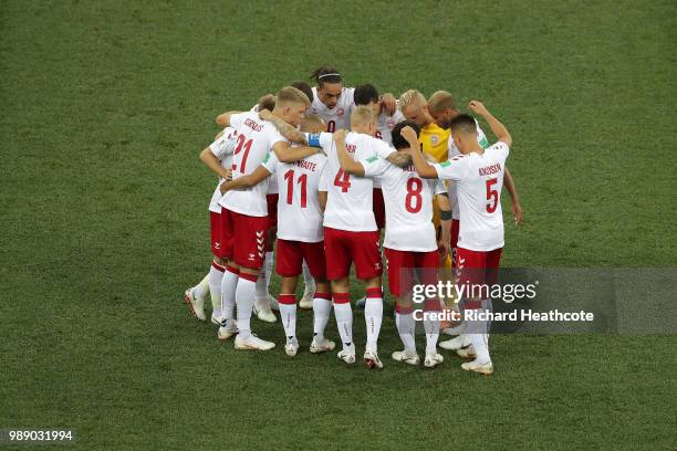 The Denmark players form a team huddle prior to the 2018 FIFA World Cup Russia Round of 16 match between Croatia and Denmark at Nizhny Novgorod...