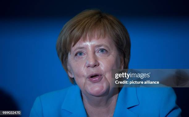 July 2018, Germany, Berlin: German Chancellor Angela Merkel waiting for the start of a meeting of the CDU executive at Konrad Adenauer Haus. Leading...