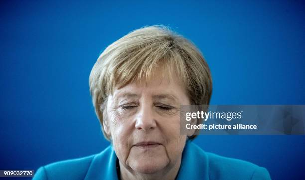 July 2018, Germany, Berlin: German Chancellor Angela Merkel waiting for the start of a meeting of the CDU executive at Konrad Adenauer Haus. Leading...