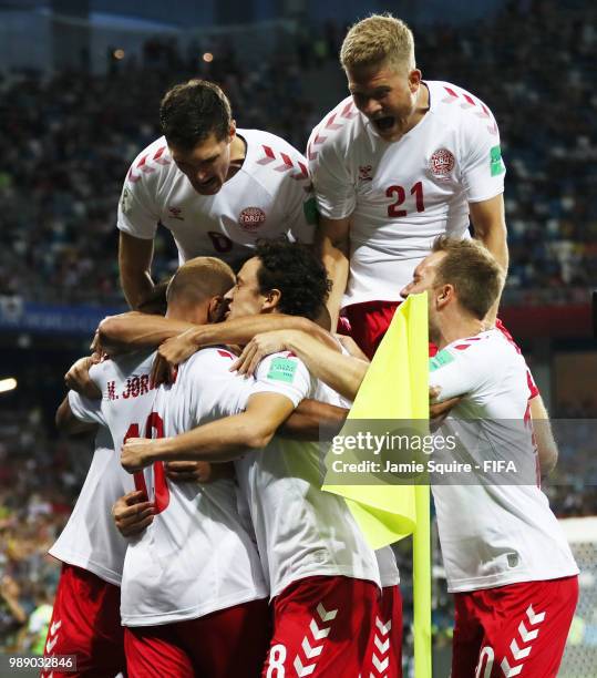 Mathias Jorgensen of Denmark celebrates with team mates after scoring his team's first goal during the 2018 FIFA World Cup Russia Round of 16 match...