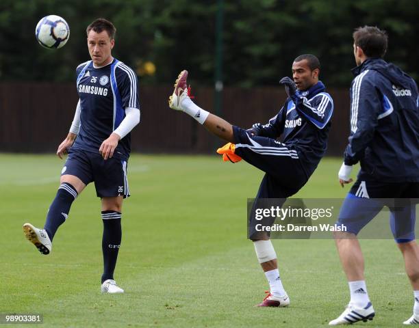 John Terry and Ashley Cole of Chelsea during a training session at the Cobham Training Ground on May 7, 2010 in Cobham, England.