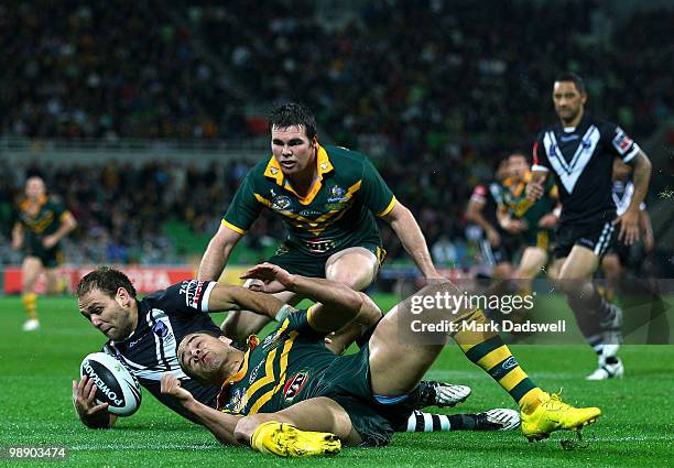 Jason Nightingale of the Kiwis is tackled by Jarryd Hayne of the Kangaroos during the ARL Test match between the Australian Kangaroos and the New...