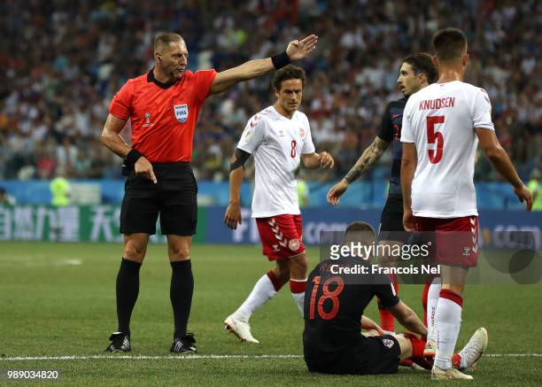 Referee Nestor Pitana awards Croatia a free kick during the 2018 FIFA World Cup Russia Round of 16 match between Croatia and Denmark at Nizhny...