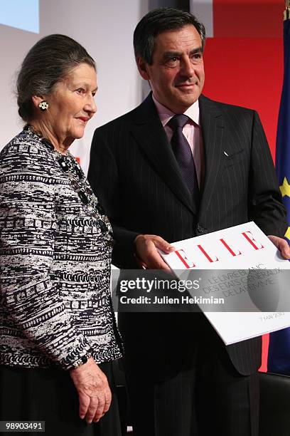 French Prime Minister Francois Fillon and former minister and European Parliament Chairwoman Simone Veil pose on the last day of the Women's Forum at...