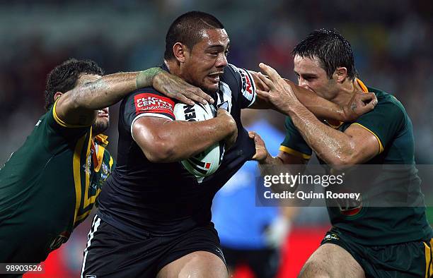 Sika Manu of the Kiwis is tackled by Cooper Cronk of the Kangaroos during the ARL Test match between the Australian Kangaroos and the New Zealand...