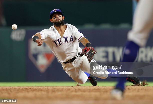 Rougned Odor of the Texas Rangers makes the throw to first base for the final out of the game against the Chicago White Sox at Globe Life Park in...