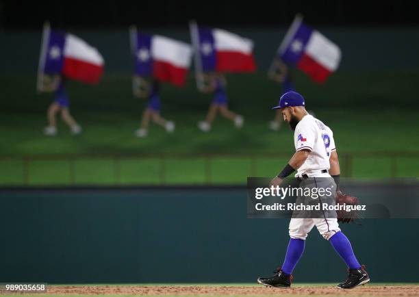 Rougned Odor of the Texas Rangers walks over to join his teammates as they celebrate the win over the Chicago White Sox at Globe Life Park in...