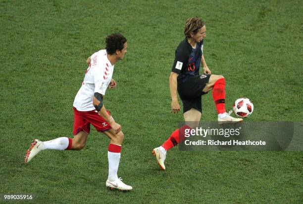 Luka Modric of Croatia is challenged by Thomas Delaney of Denmark during the 2018 FIFA World Cup Russia Round of 16 match between Croatia and Denmark...